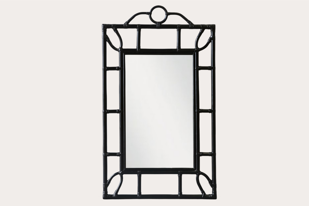 Tropical-style rattan mirror with black bamboo-look frame and circular top detail