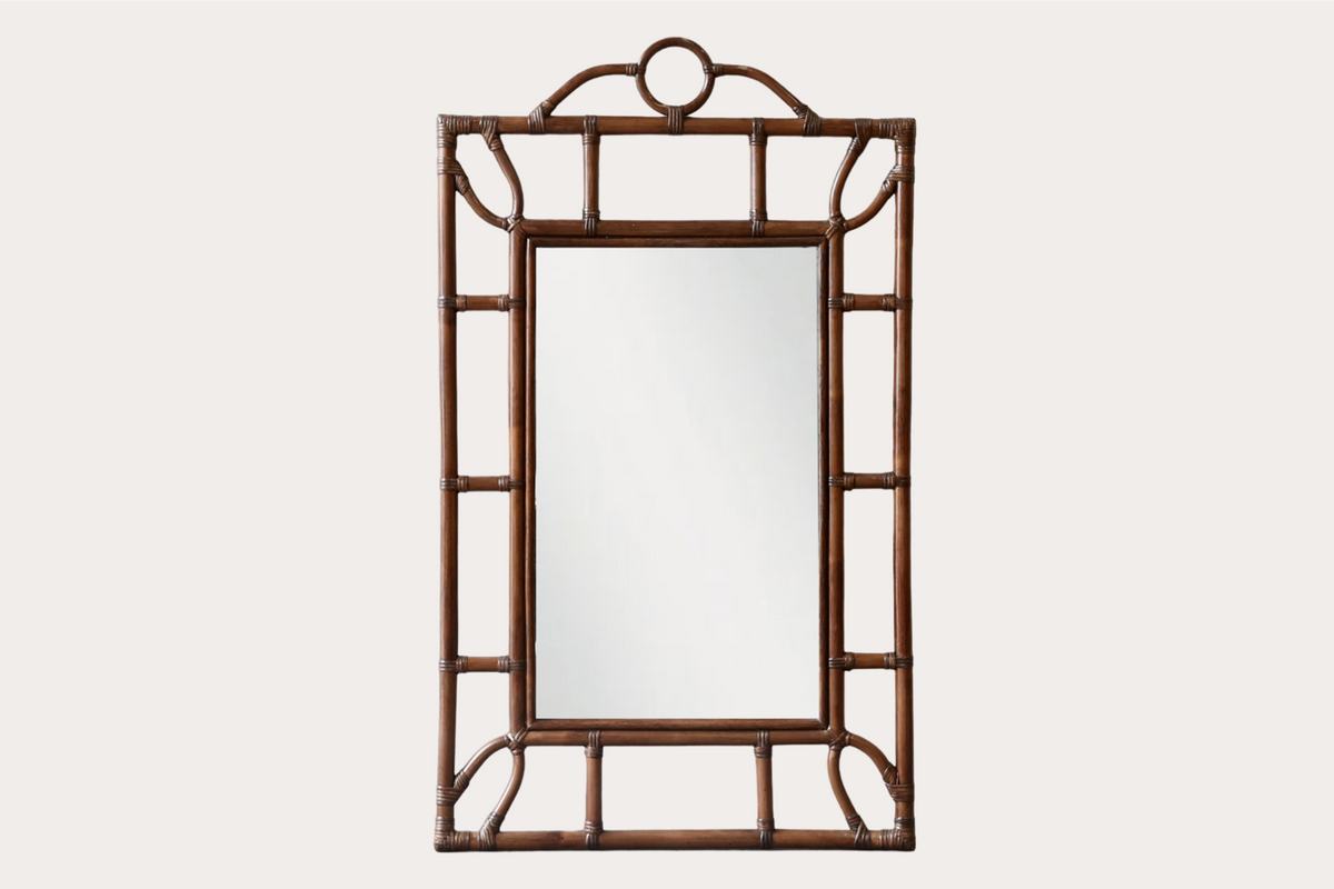 Tropical-style rattan mirror with Brown bamboo-look frame and circular top detail