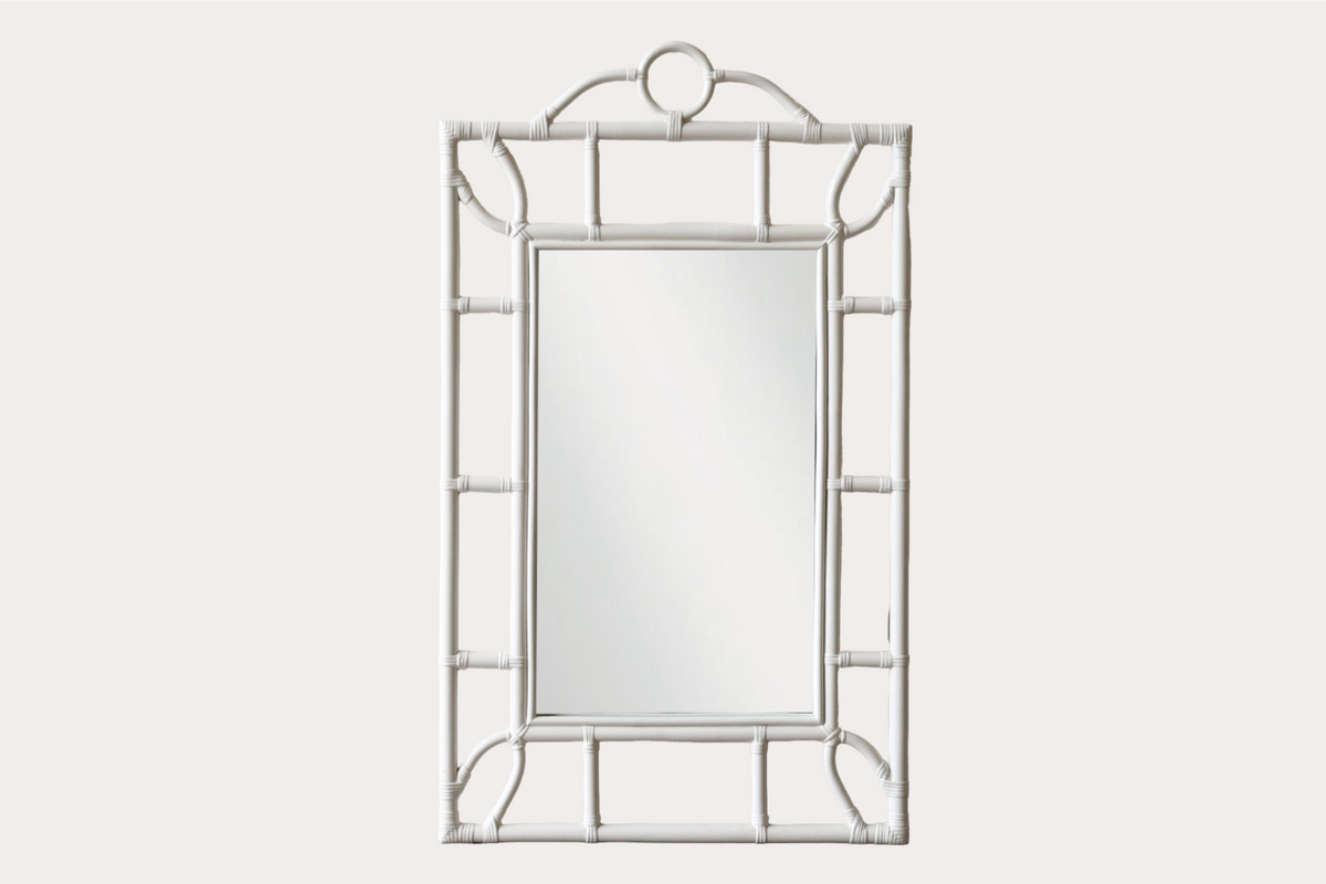 Tropical-style rattan mirror with white bamboo-look frame and circular top detail