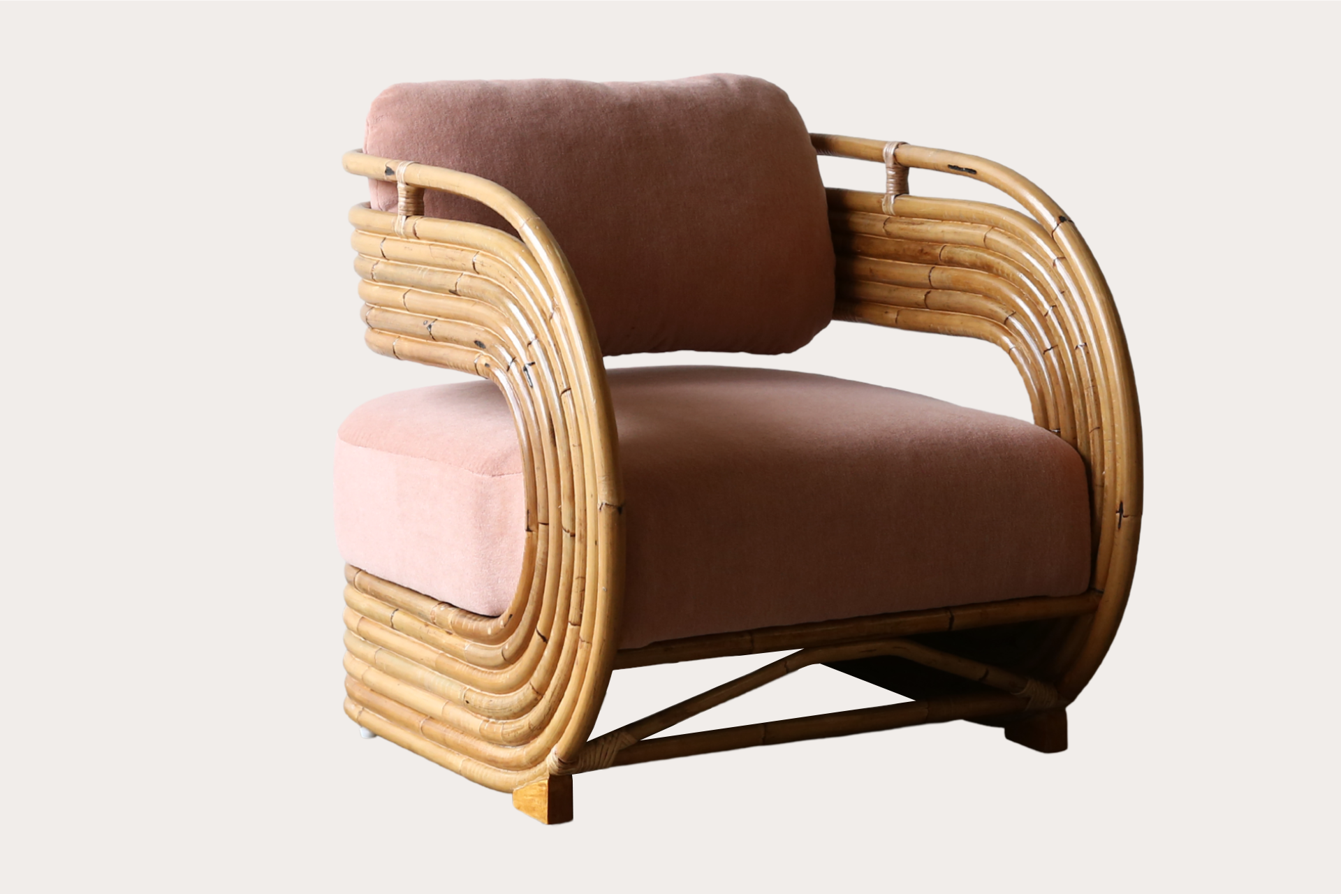 front photo of the C45 Brooklyn armchair upholstered in a soft pink velvet fabric. this rattan and cane armchair is suitable for commercial venues and projects