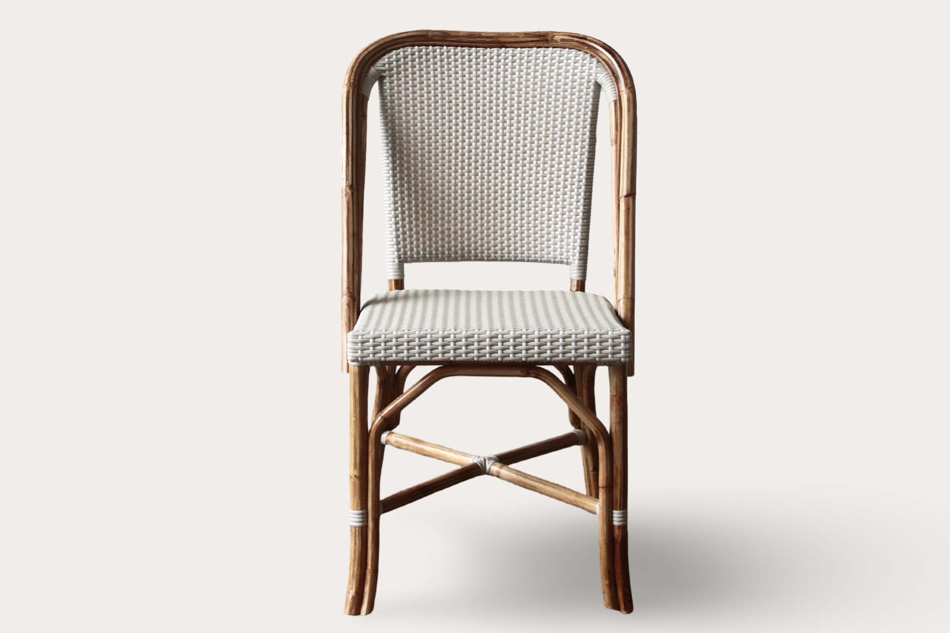 Rattan cafe style dining chair in natural rattan suitable for commercial Paris style cafes and dining areas.