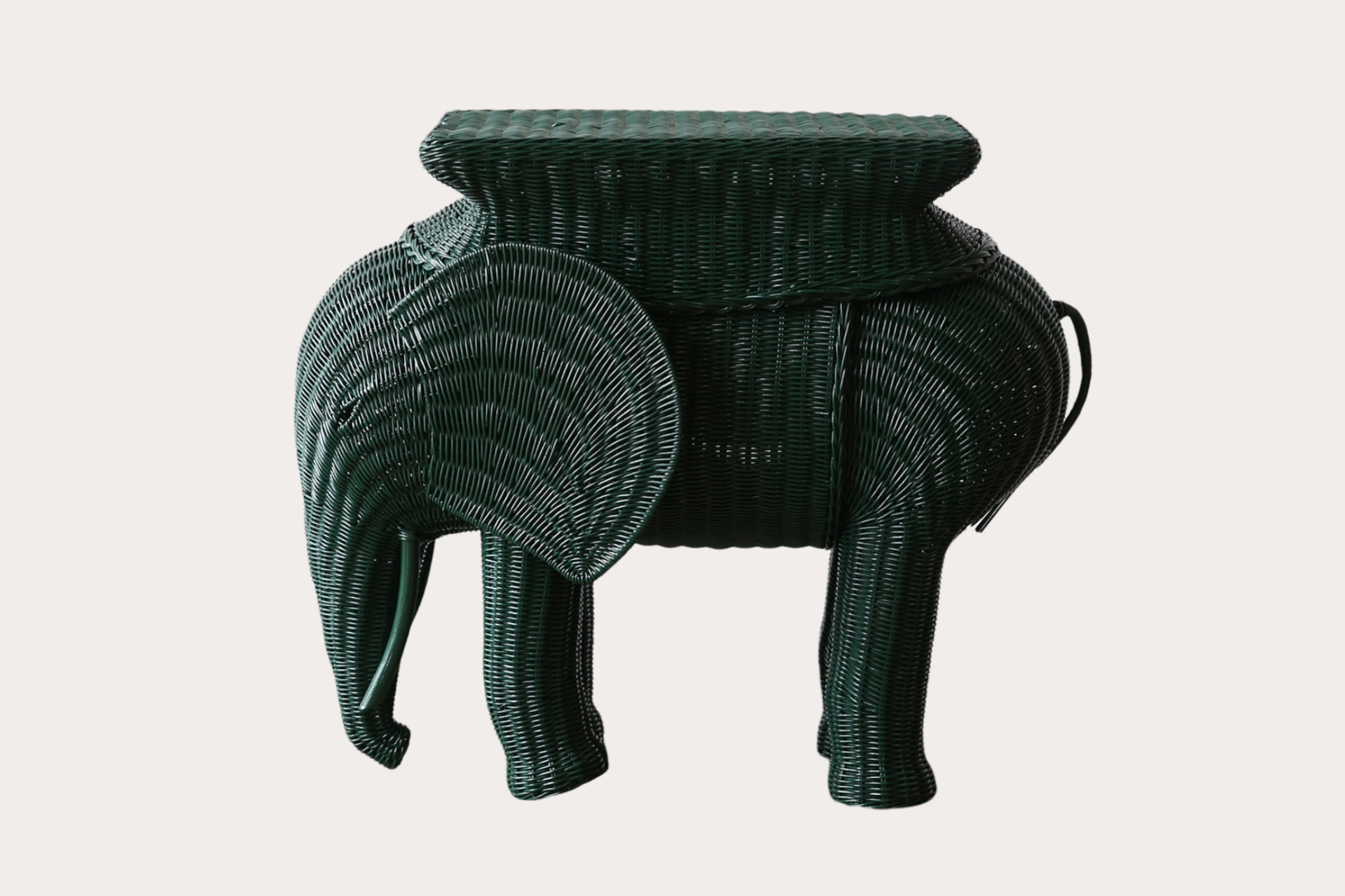 The Jelani Elephant side table is made using natural woven wicker over a rattan and timber frame.