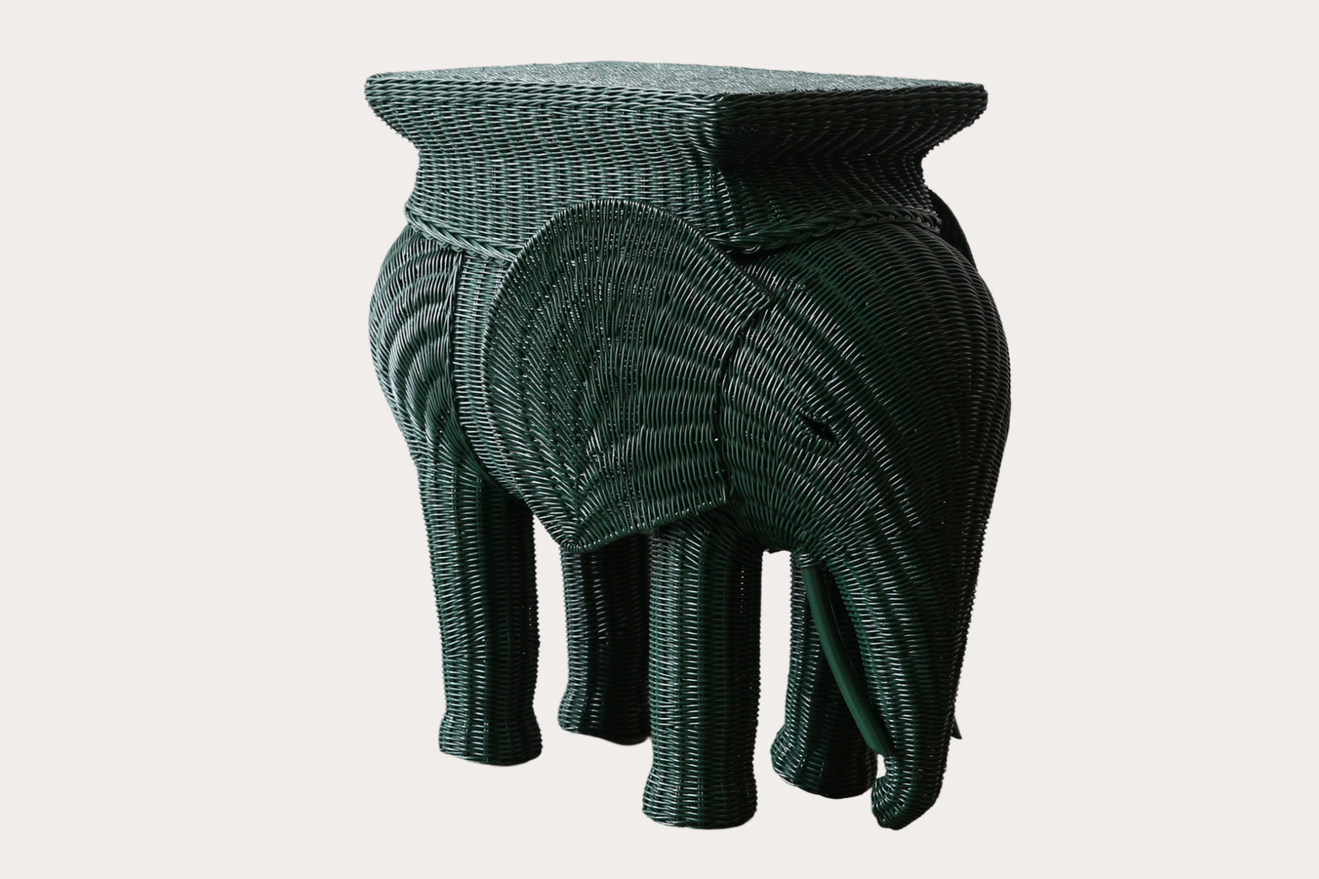 The Jelani Elephant side table is made using natural woven wicker over a rattan and timber frame.