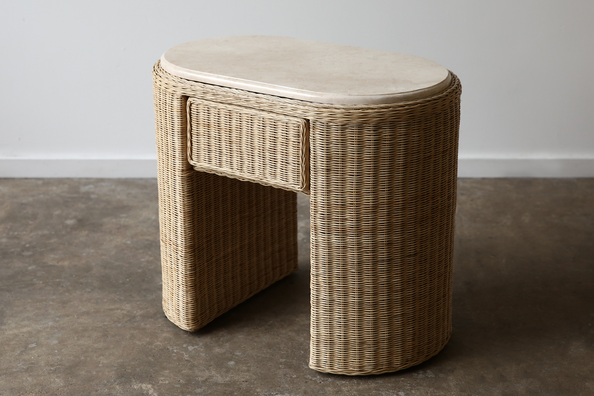 wicker nightstand bedside table with marble top in natural rattan.