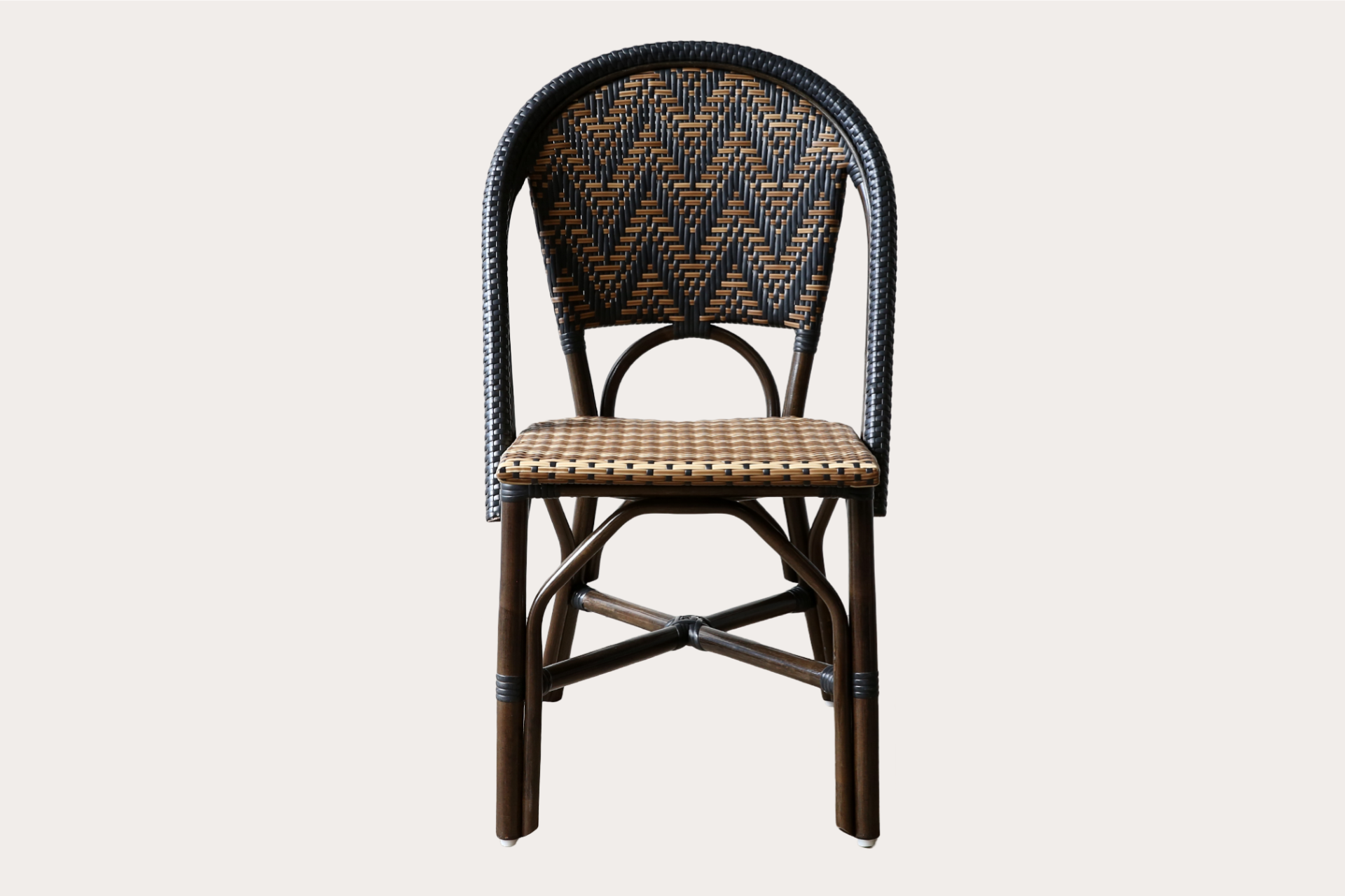 Commercial-grade woven side chair with black and natural chevron pattern, suitable for indoor and outdoor dining