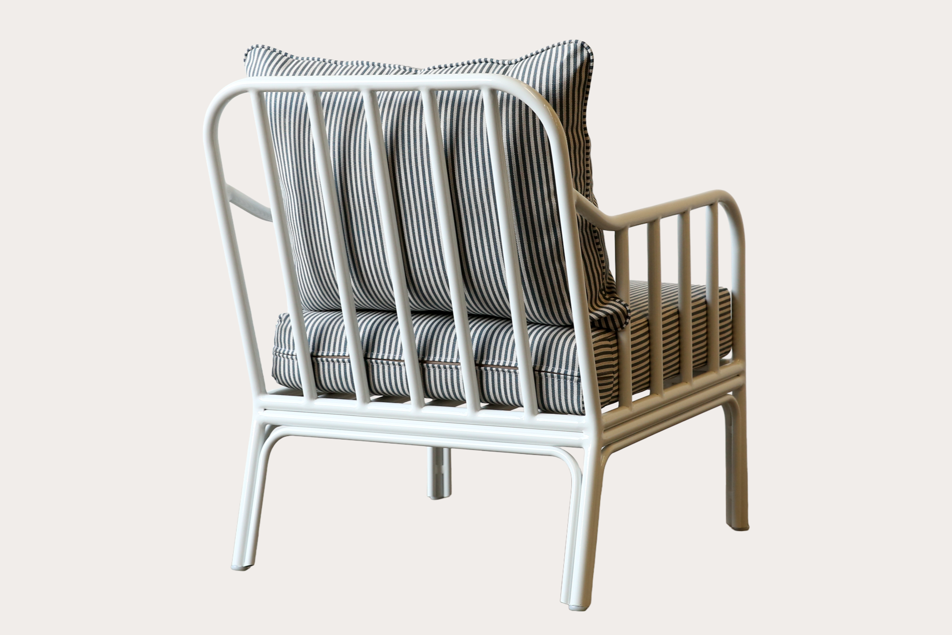 Outdoor aluminium armchair made using aluminium powder coated in white with a custom upholstery fabric.