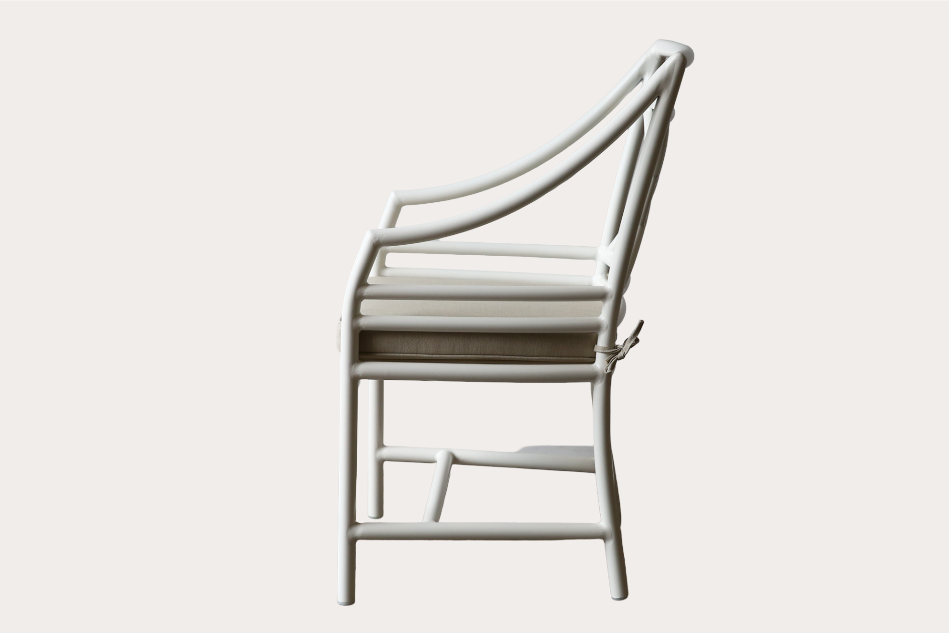 Target carver chair made from powder-coated aluminium with cushion seat and knotted back detail