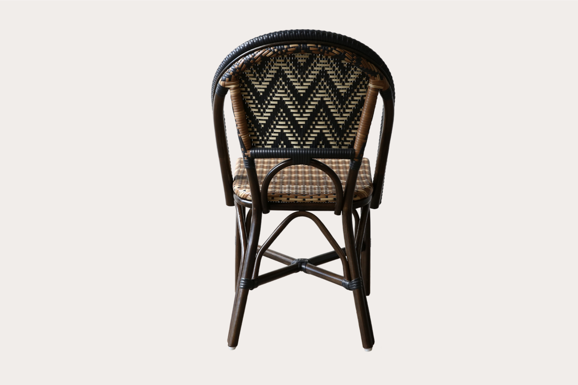 Commercial-grade woven side chair with black and natural chevron pattern, suitable for indoor and outdoor dining